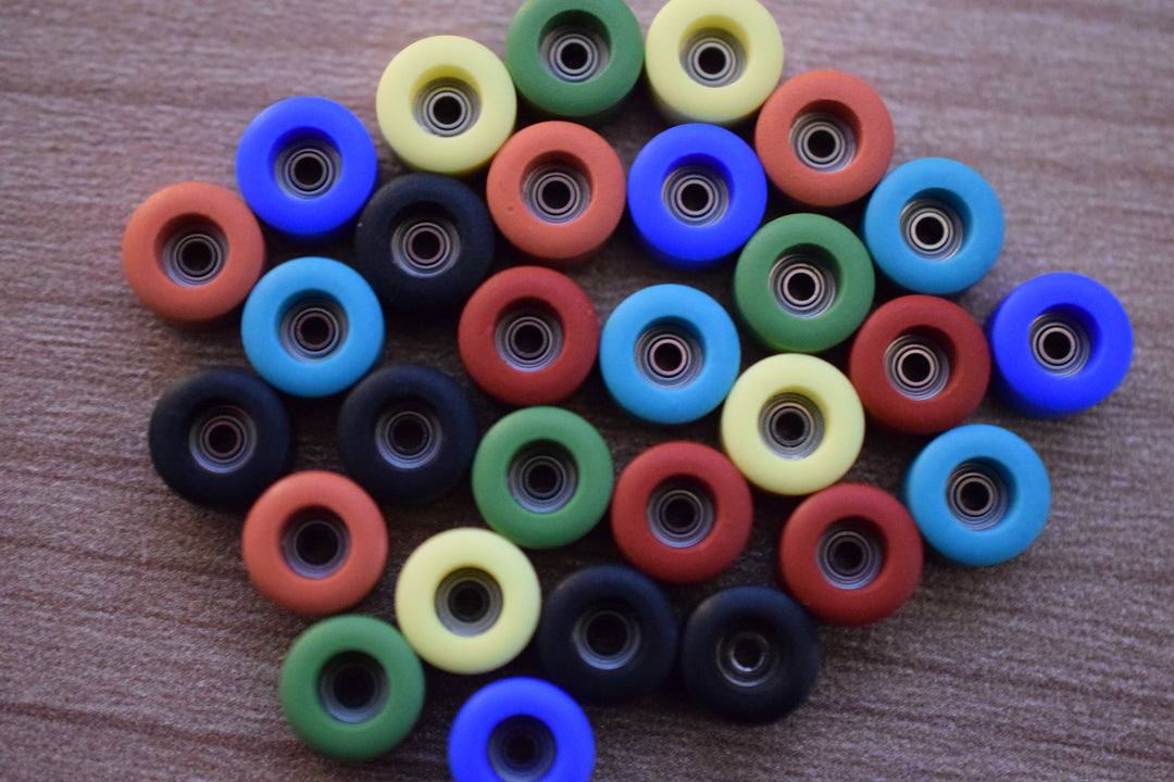 fingerboard wheels laying on a table
