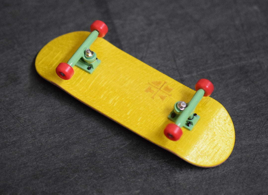 Teak Tuning 32mm Prolific Gen2 Fingerboard Complete - "Rad Rasta" Colorway - Gen2 Prodigy Trucks + Pro Duro Bubble Bushings