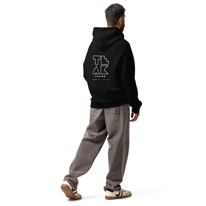 TEAK Outline Logo Heavyweight Hoodie in black, worn, three-quarter back view