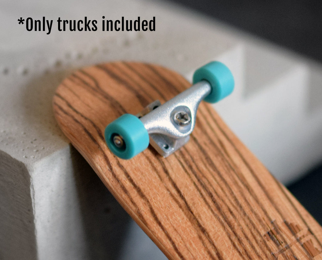 Teak Tuning Prodigy Pro Plus Trucks, Silver Colorway - 32mm Wide - Includes 61A Pro Duro Bubble Bushings in Clear Glow + 2 Clear Pivot Cups